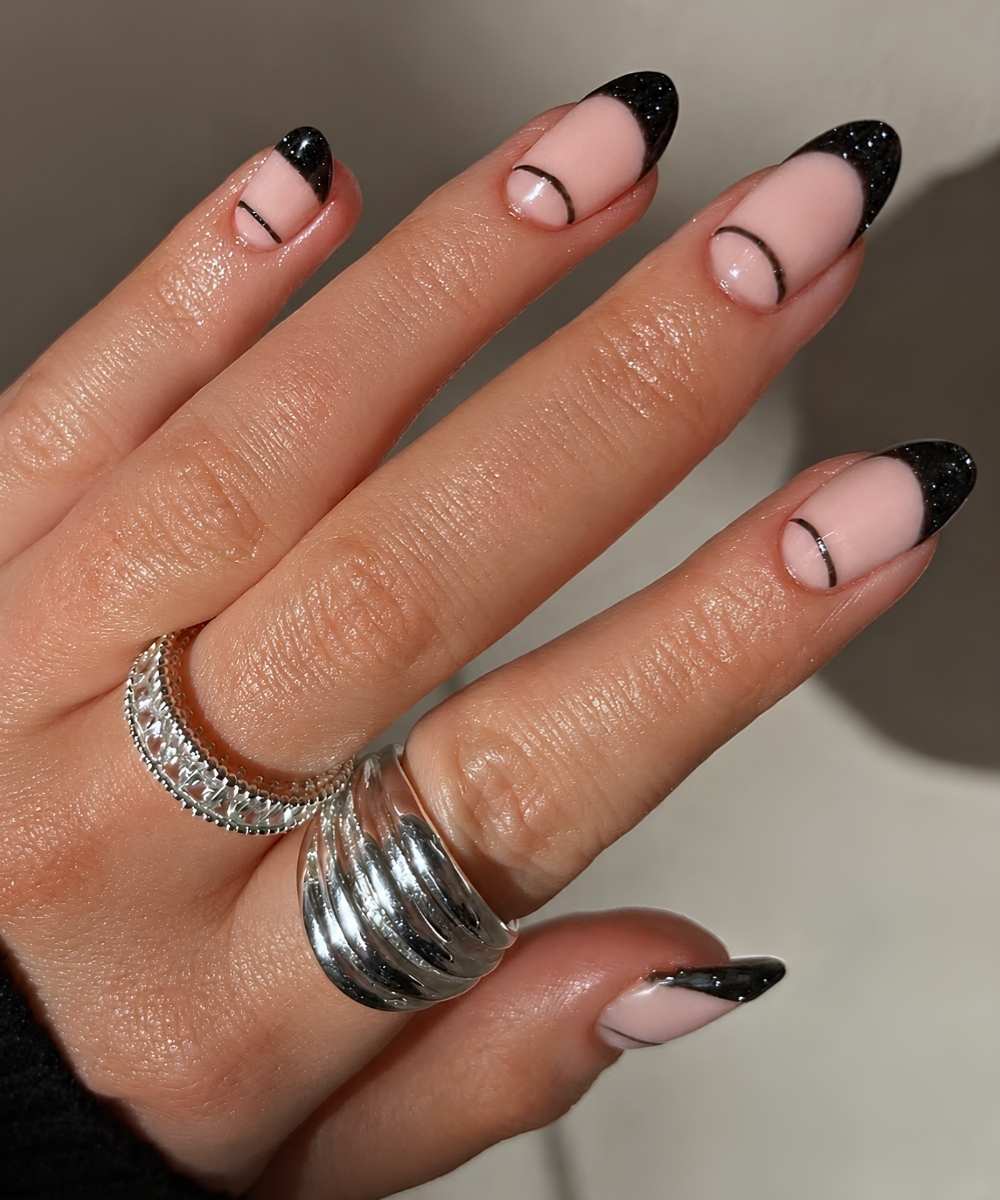 Shimmery black French mani with half moons