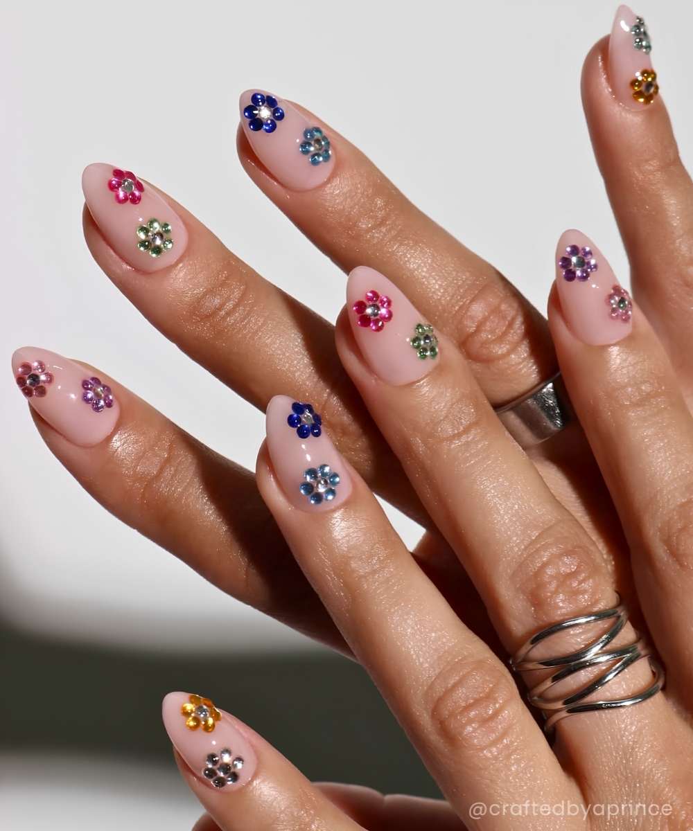 Short almond nails with gem flowers
