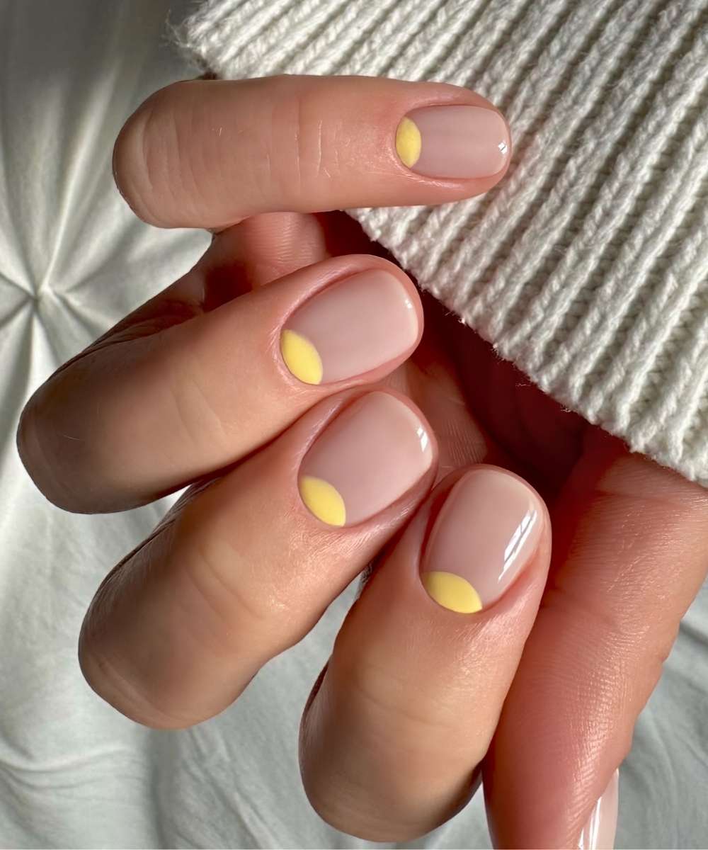 Short neutral mani with yellow half moons