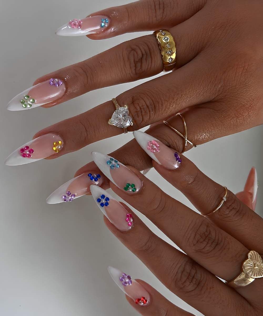 White French mani with colorful gem flowers