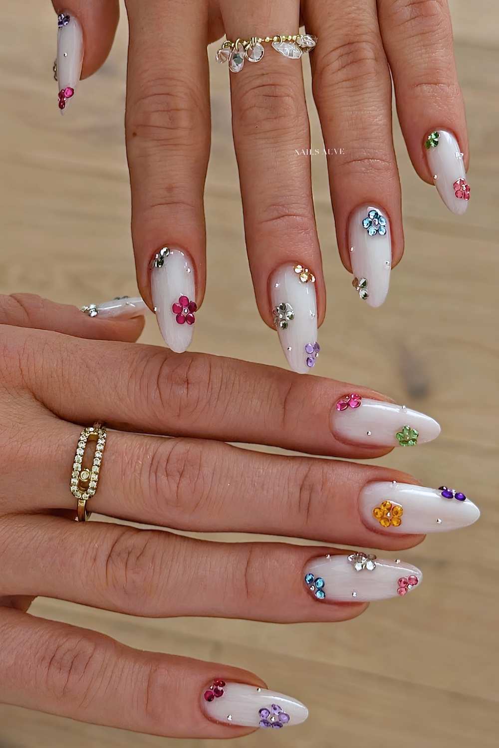 White mani with colorful gem flowers