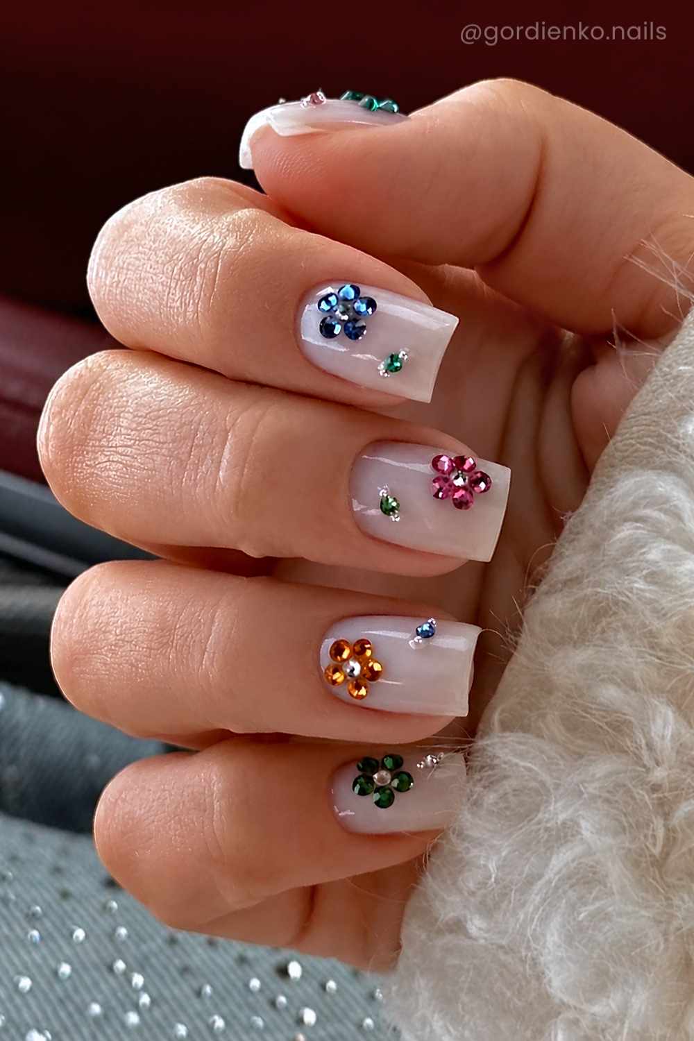 White square nails with rhinestone flowers