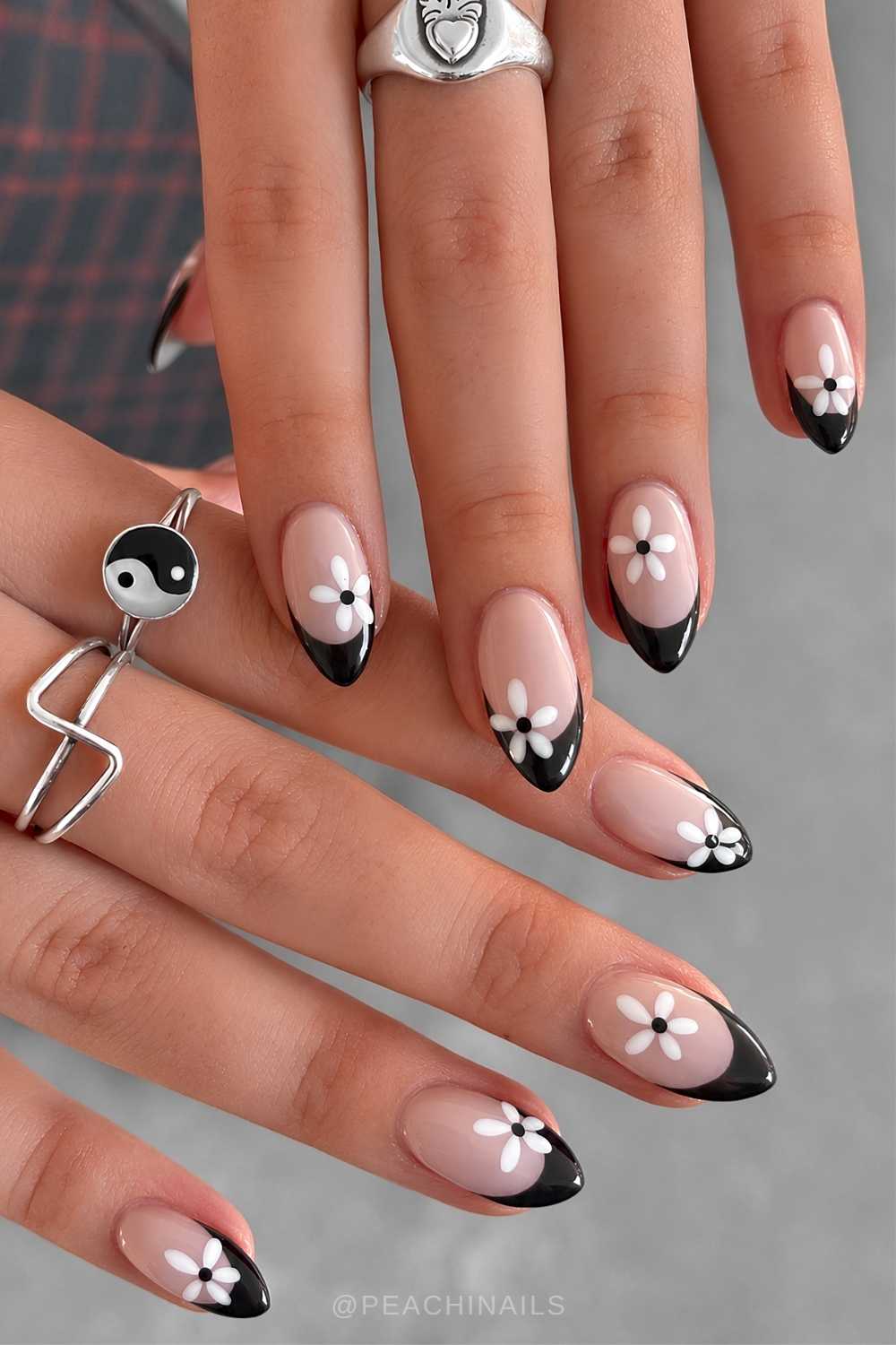 Black French manicure with white floral art