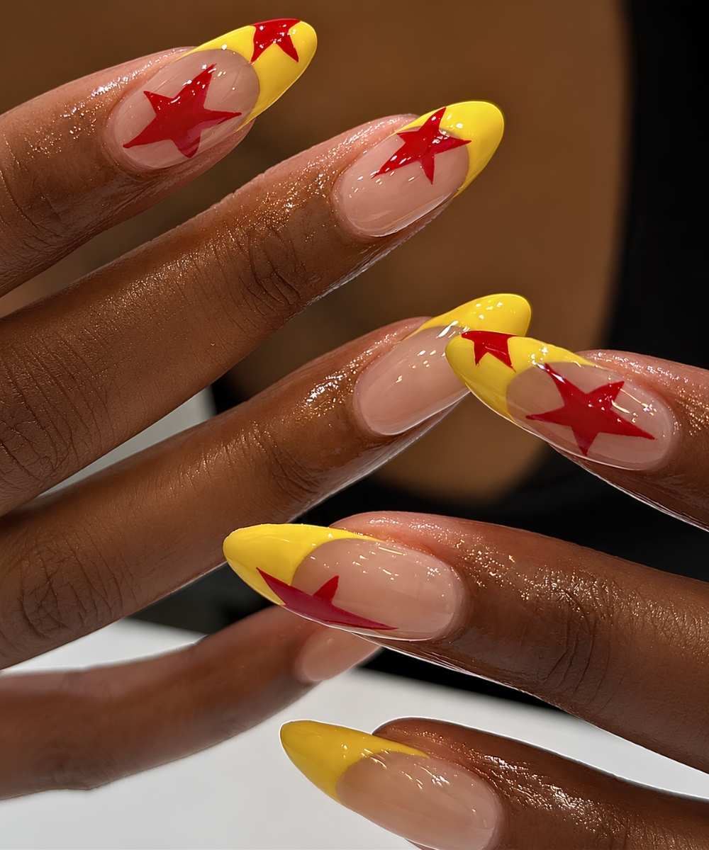 Bright yellow French nails with red stars