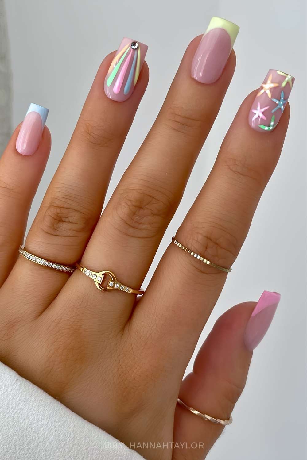 Colorful French mani with rainbow and star art