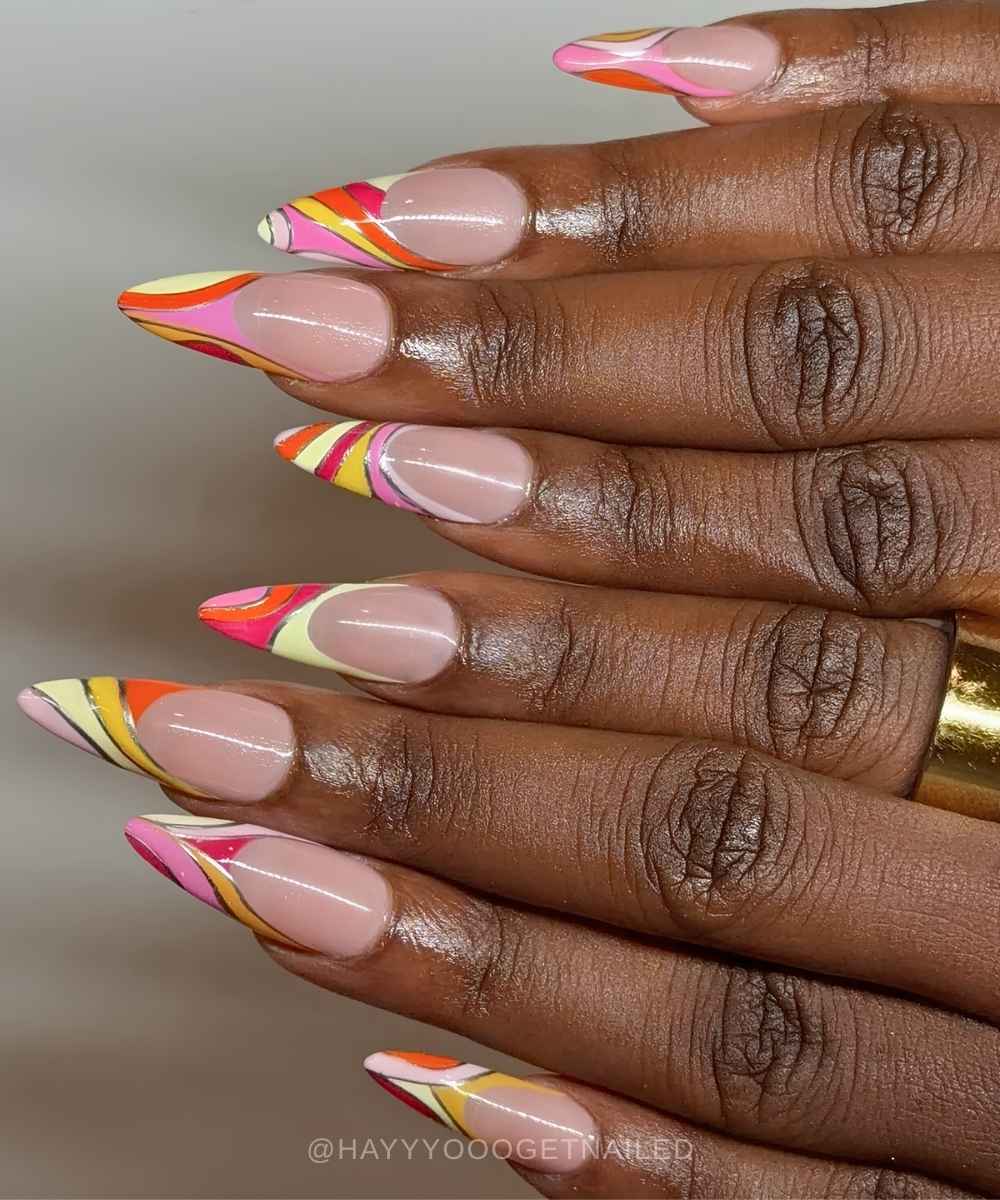 Colorful Pucci French tip nails with metallic details