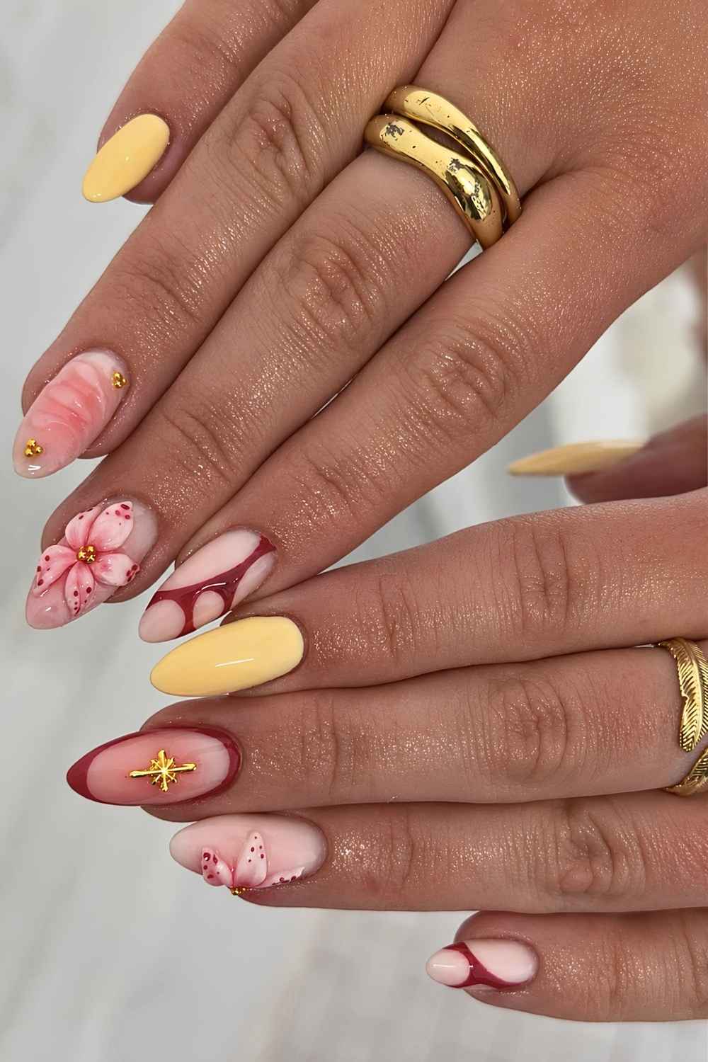 Dark red and yellow mismatched nails