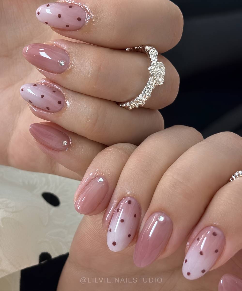 Mauve and white gradient nails with polka dots