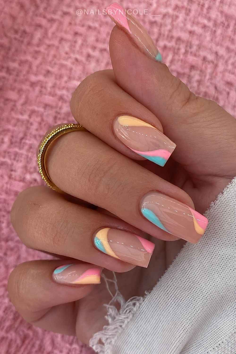 Neutral mani with colorful candy swirls