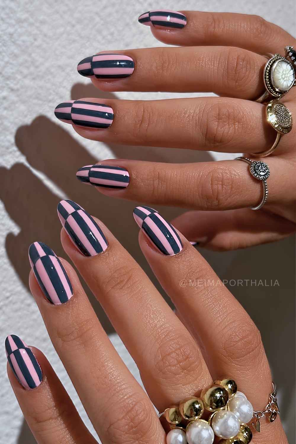 Pink nails with dark gray stripes
