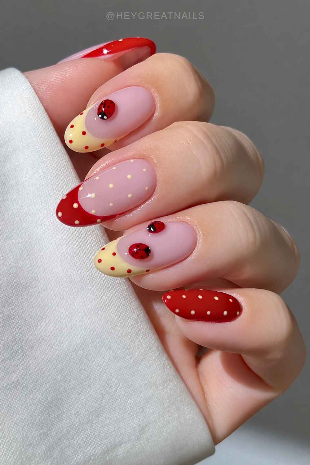 Red and yellow mani with dots and ladybugs