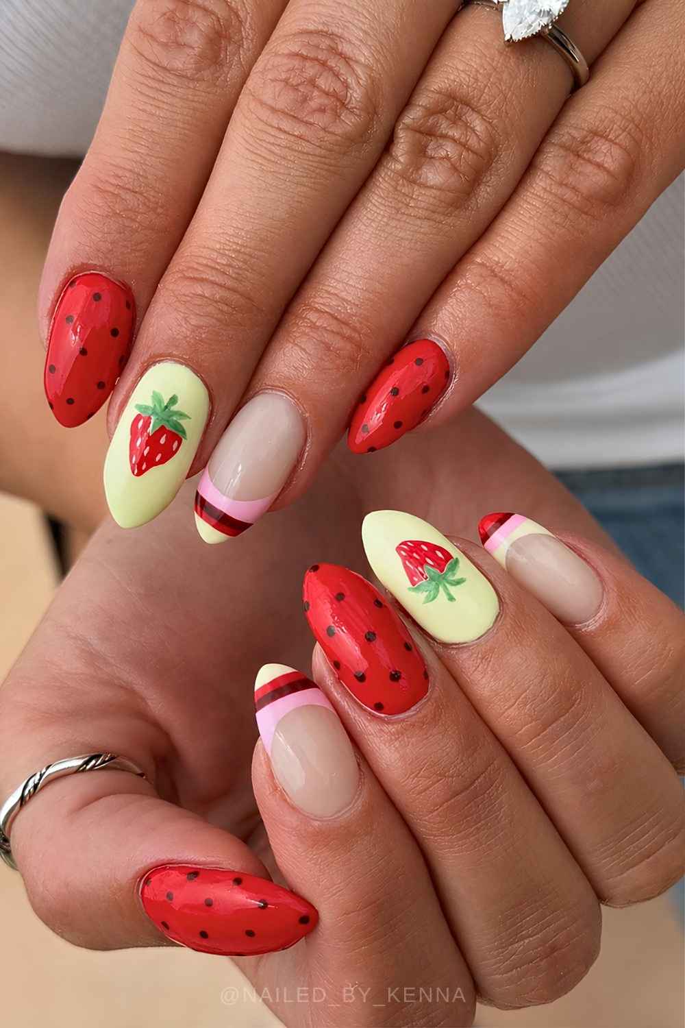 Red and yellow nails with strawberries and stripes