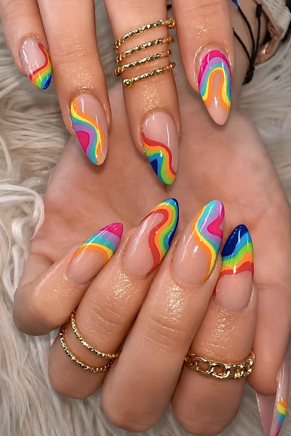 Sheer nails with rainbow inspired swirls
