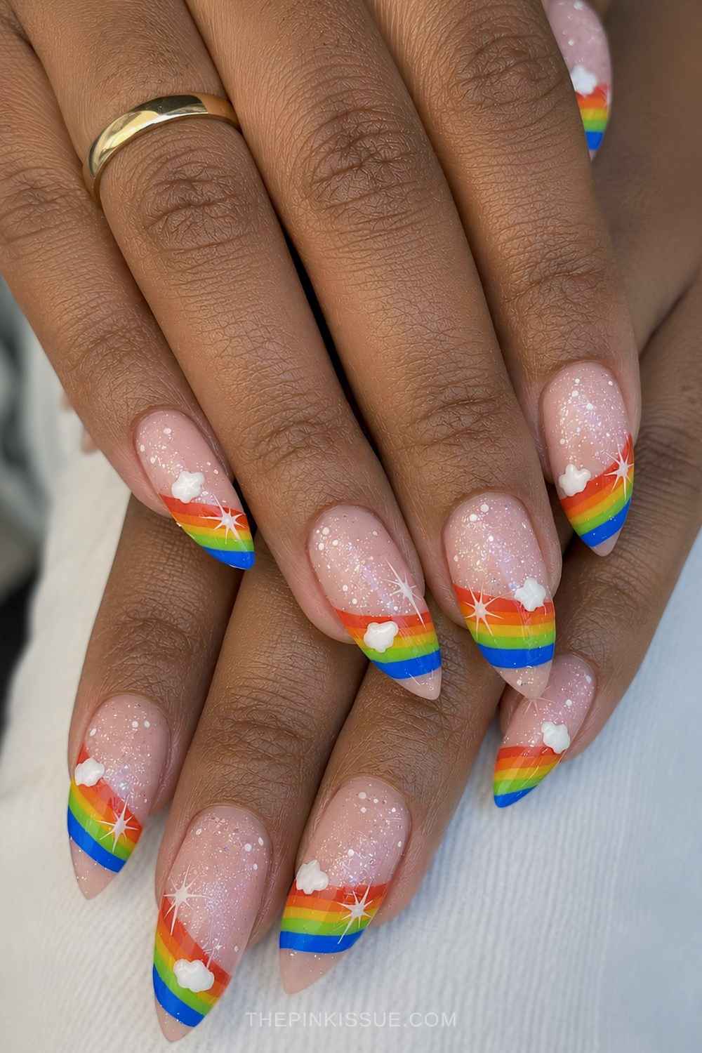 Shimmery nails with rainbow and cloud art