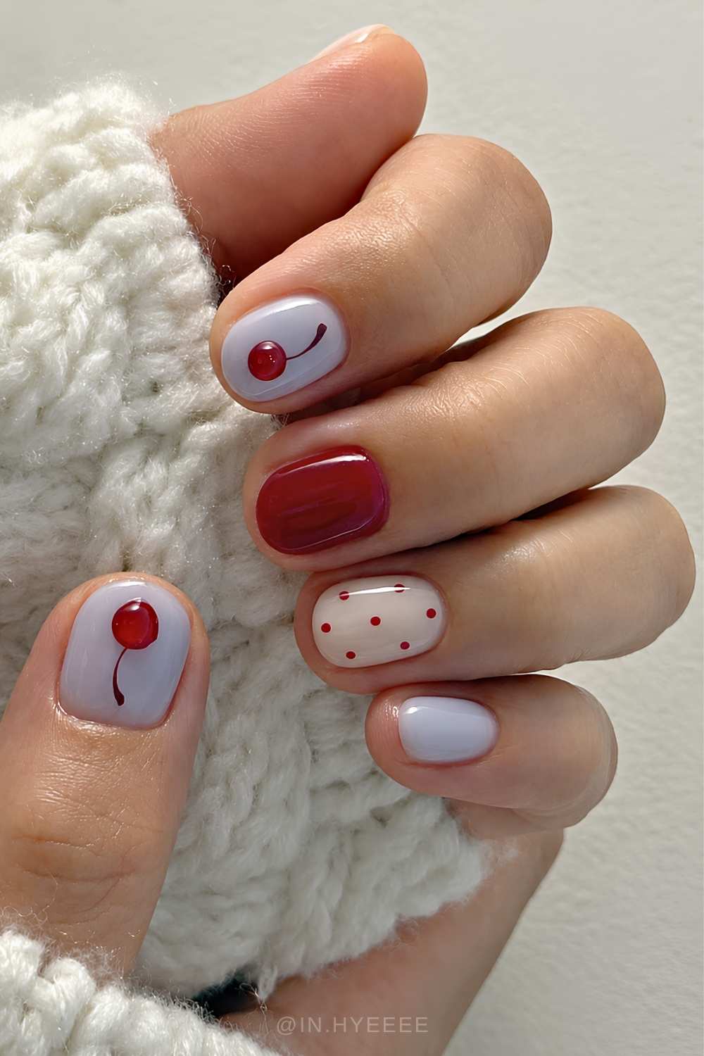Short red and blue mani with cherries and dots