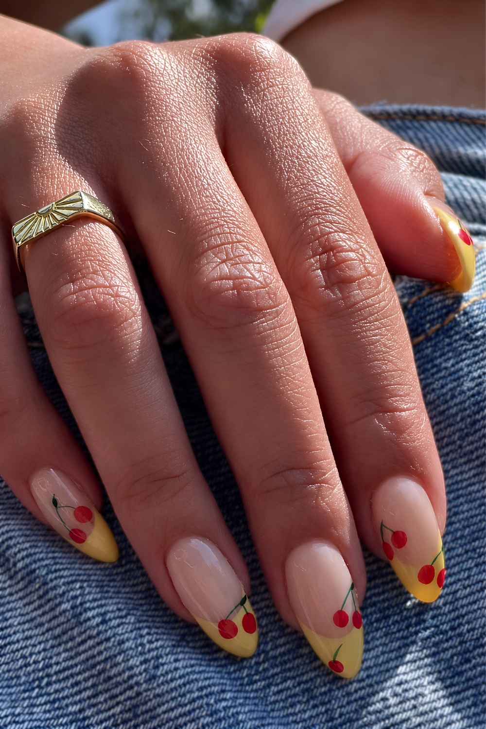 Yellow French nails with red cherry art