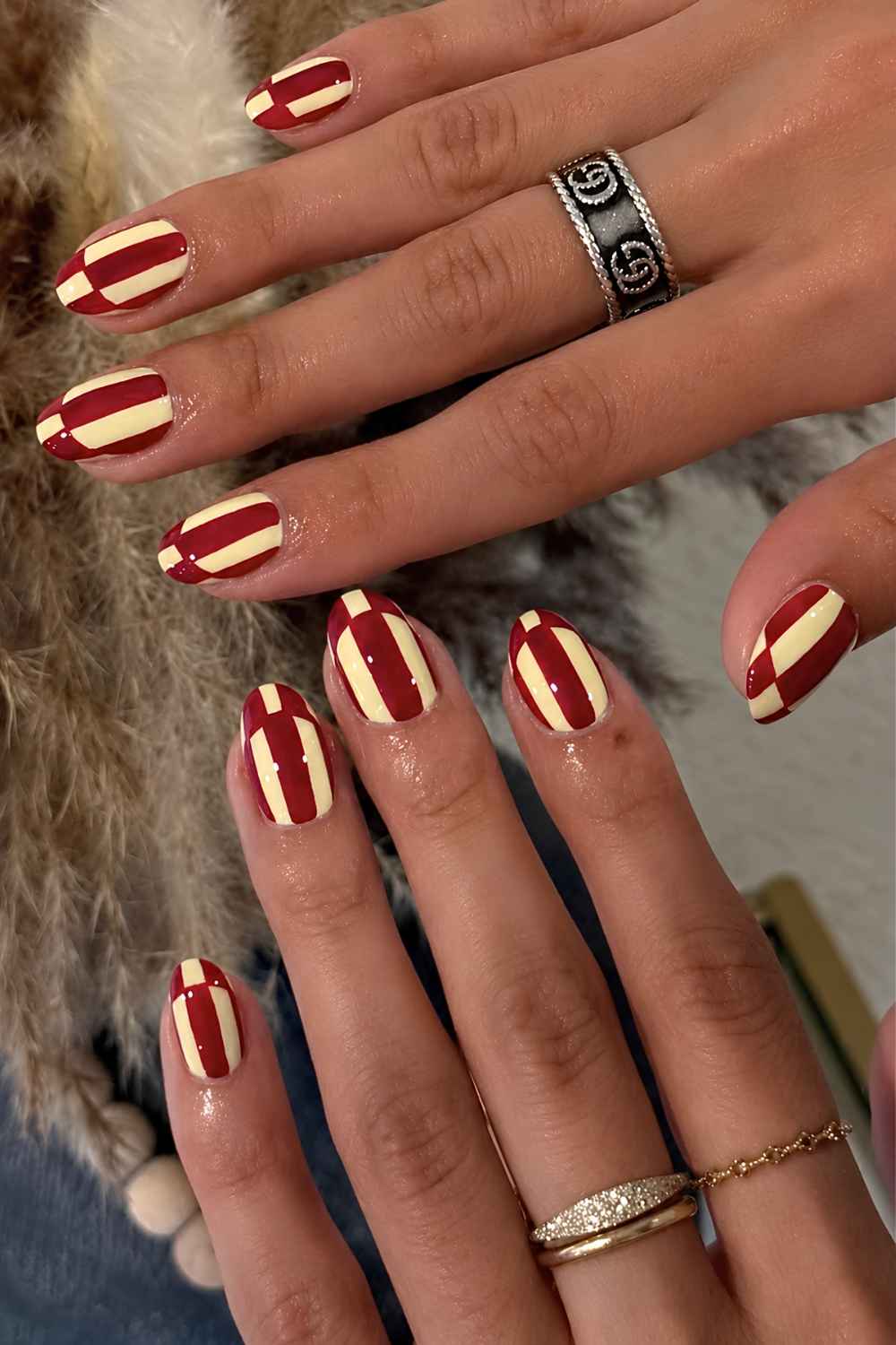 Yellow and dark red striped nails
