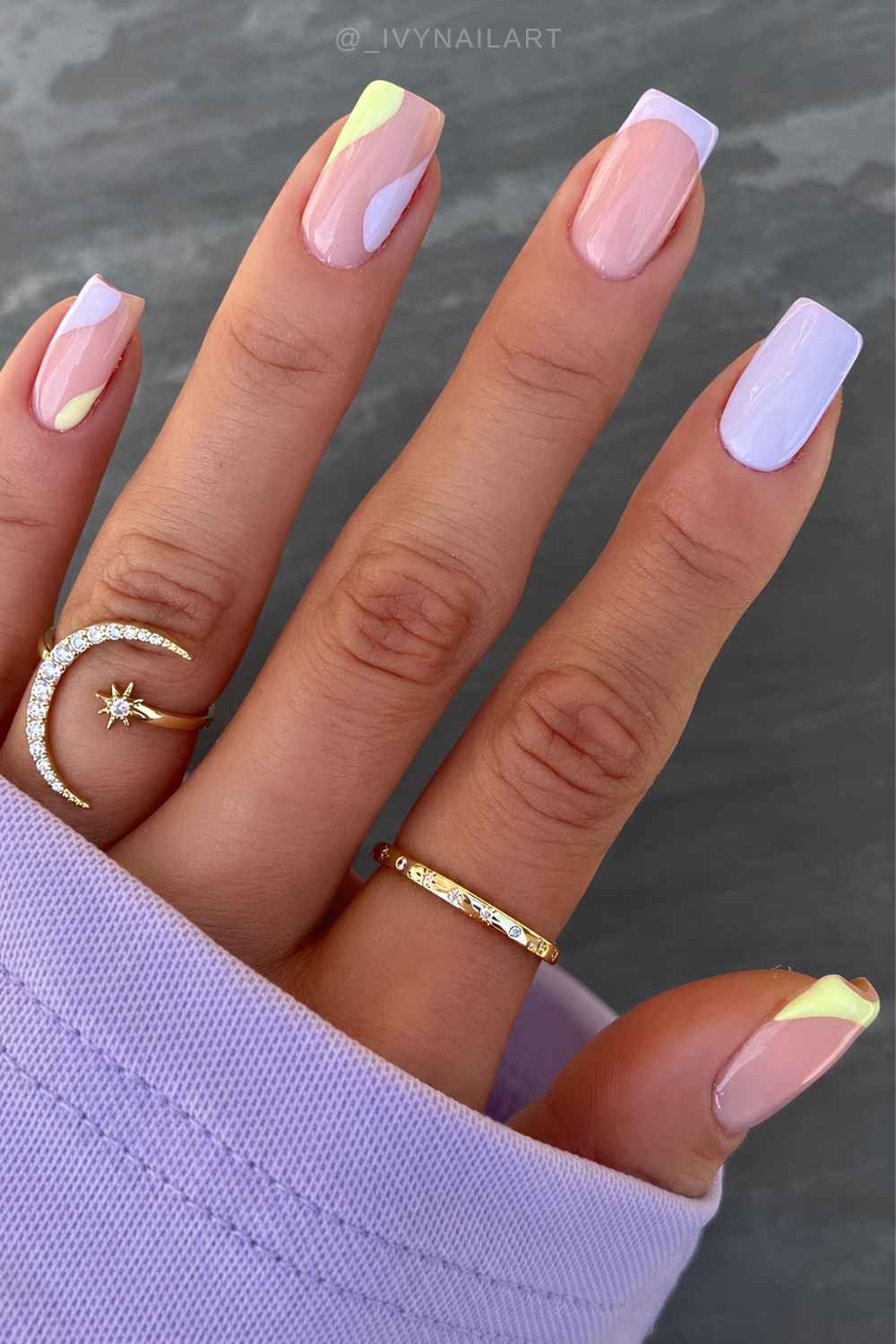 Yellow and purple nails with negative space