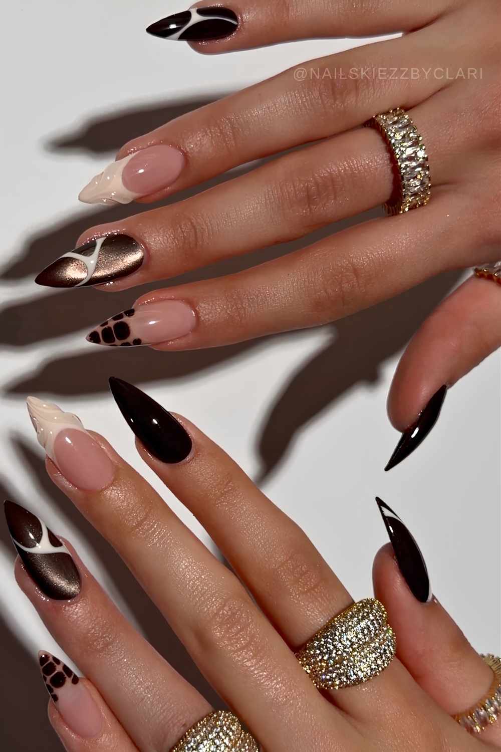 Black and vanilla nails with cat eye and line art