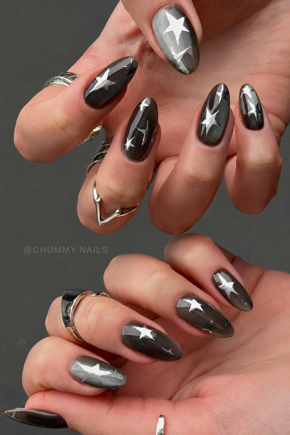 Black cat eye nails with silver stars
