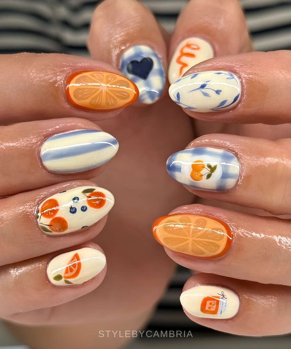 Blue and vanilla picnic nails with orange fruit art