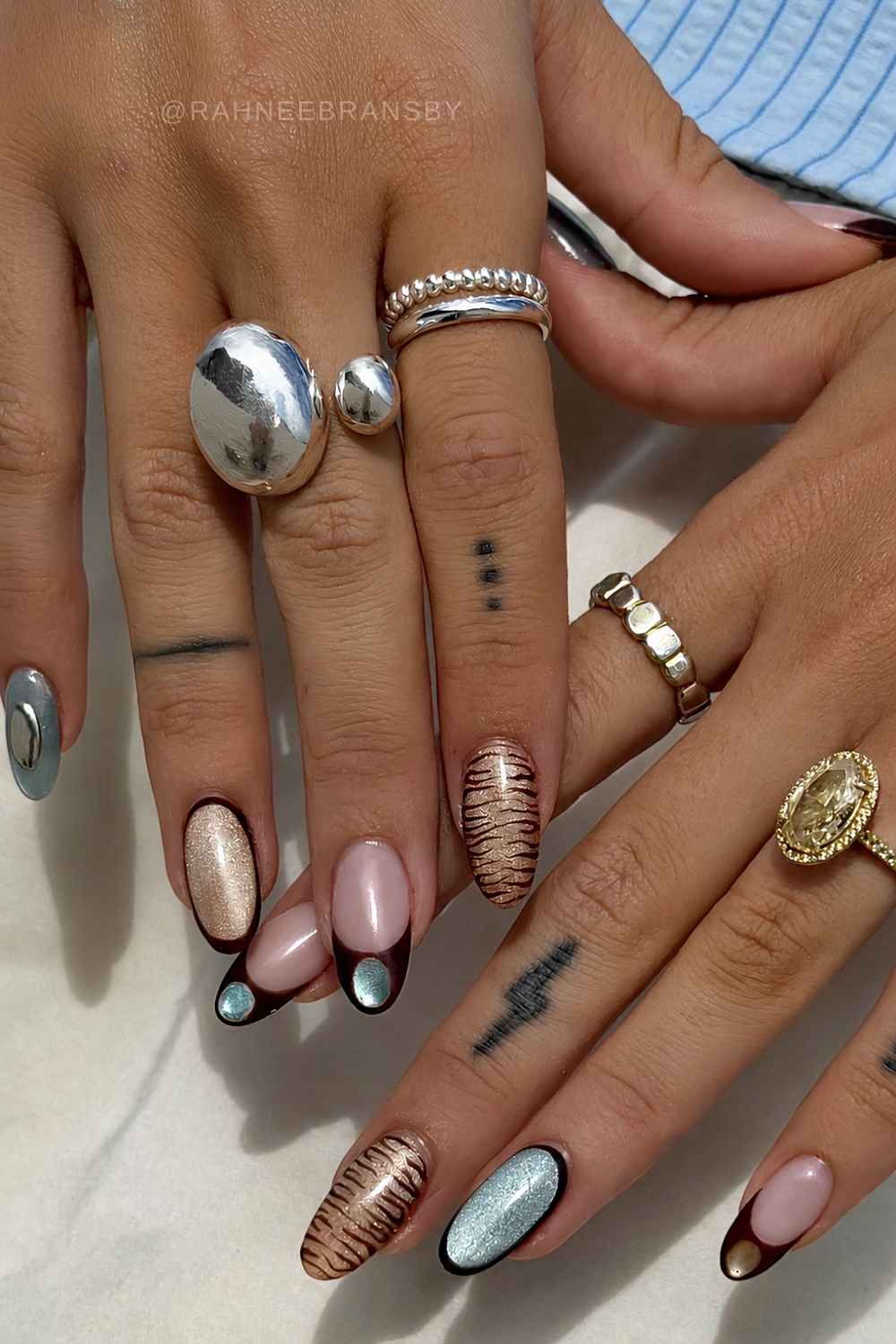 Brown and blue cat eye nails with zebra print