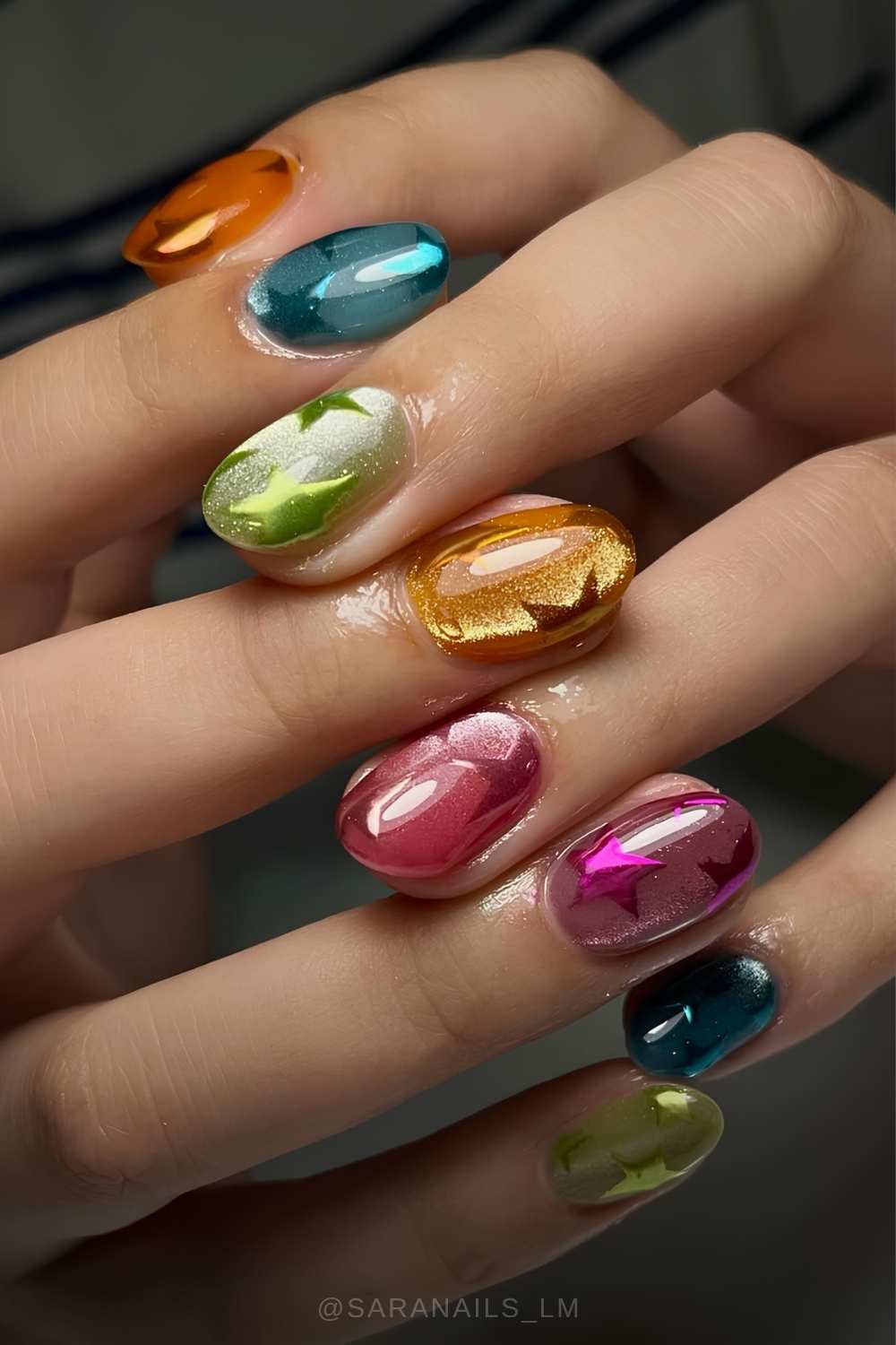 Colorful cat eye nails with chrome stars