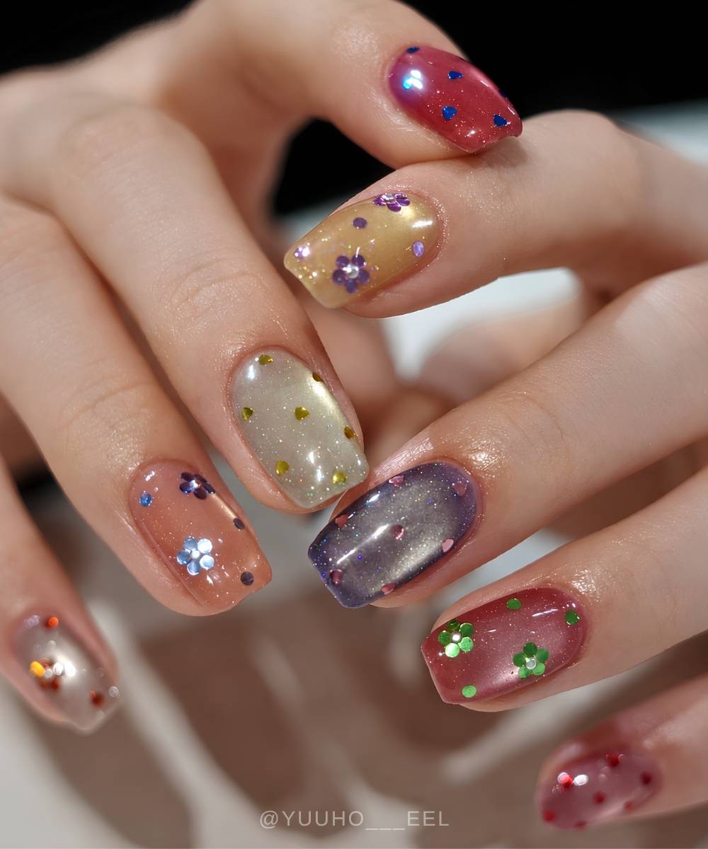 Colorful cat eye nails with hearts and flowers