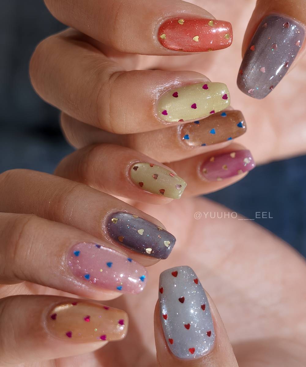Colorful cat eye nails with micro heart decals