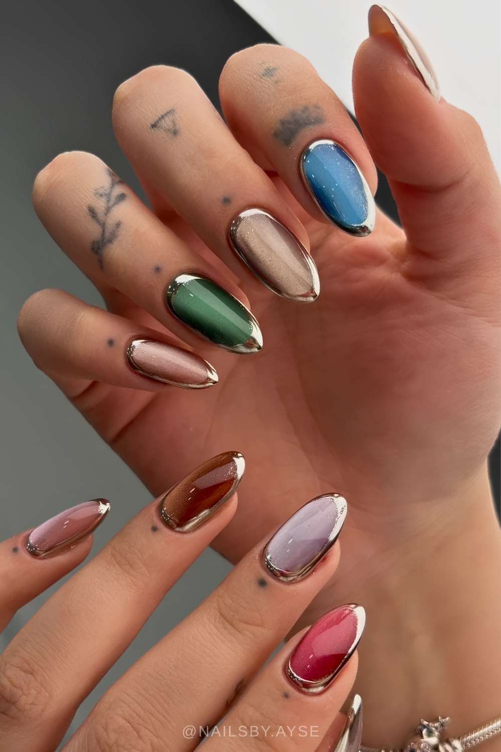 Colorful cat eye nails with silver outlines
