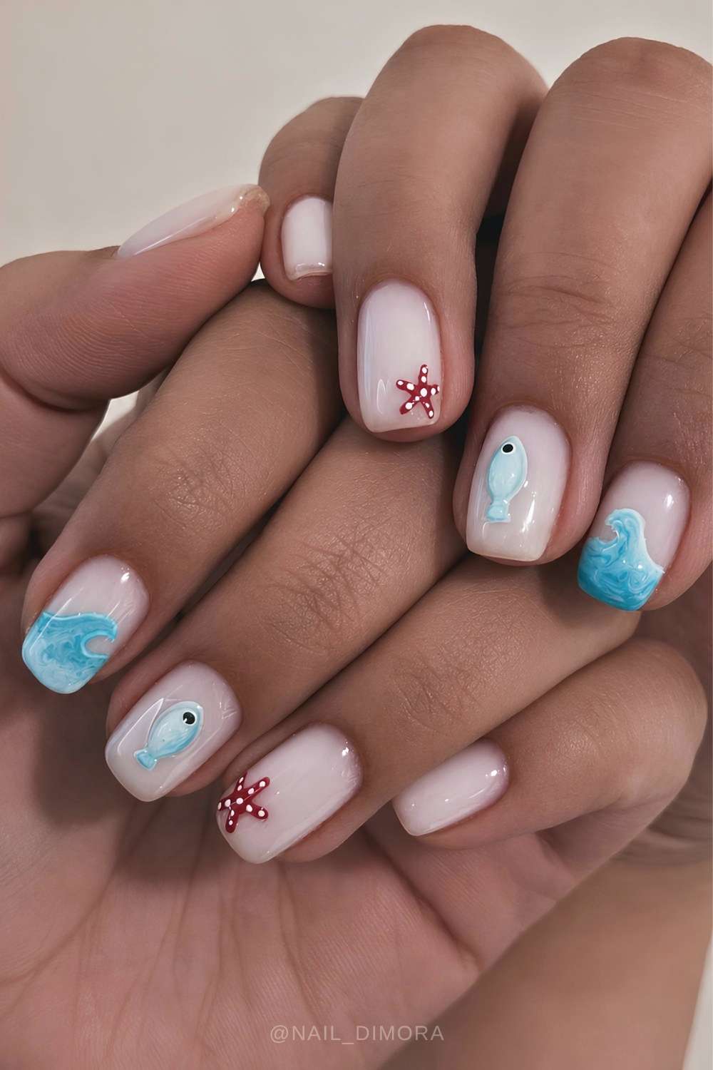 Milky white nails with wave and fish art