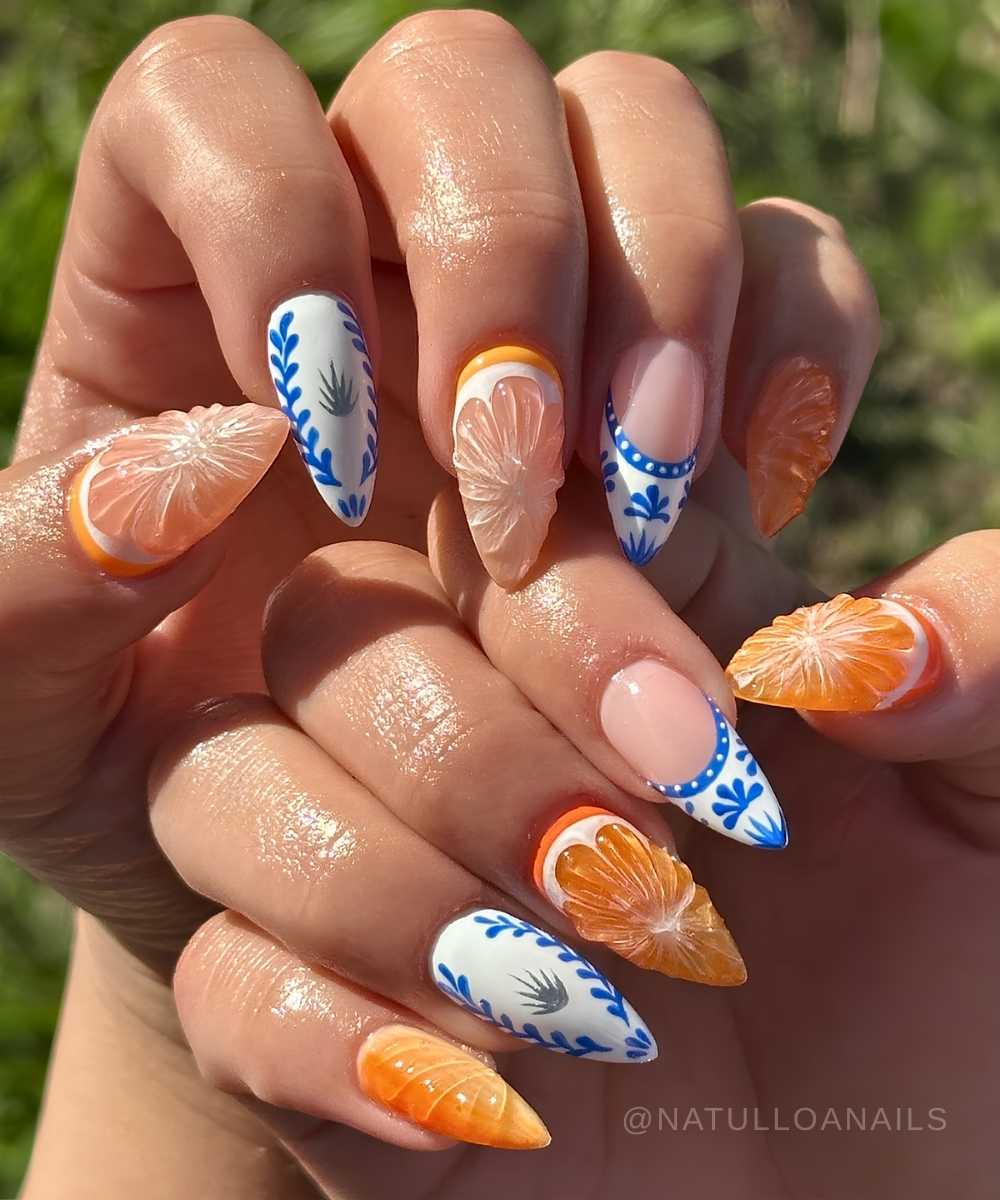 Orange and blue mani with citrus slices and tile flowers