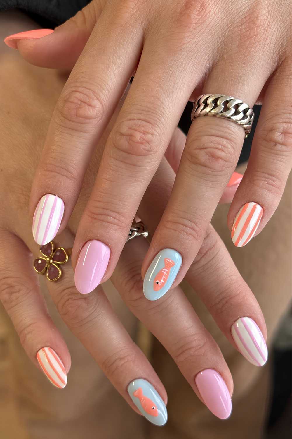 Pastel nails with stripe and fish accents