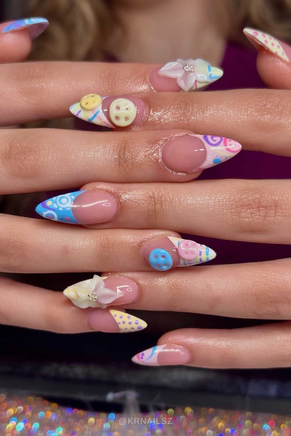 Patterned pastel French nails with button art