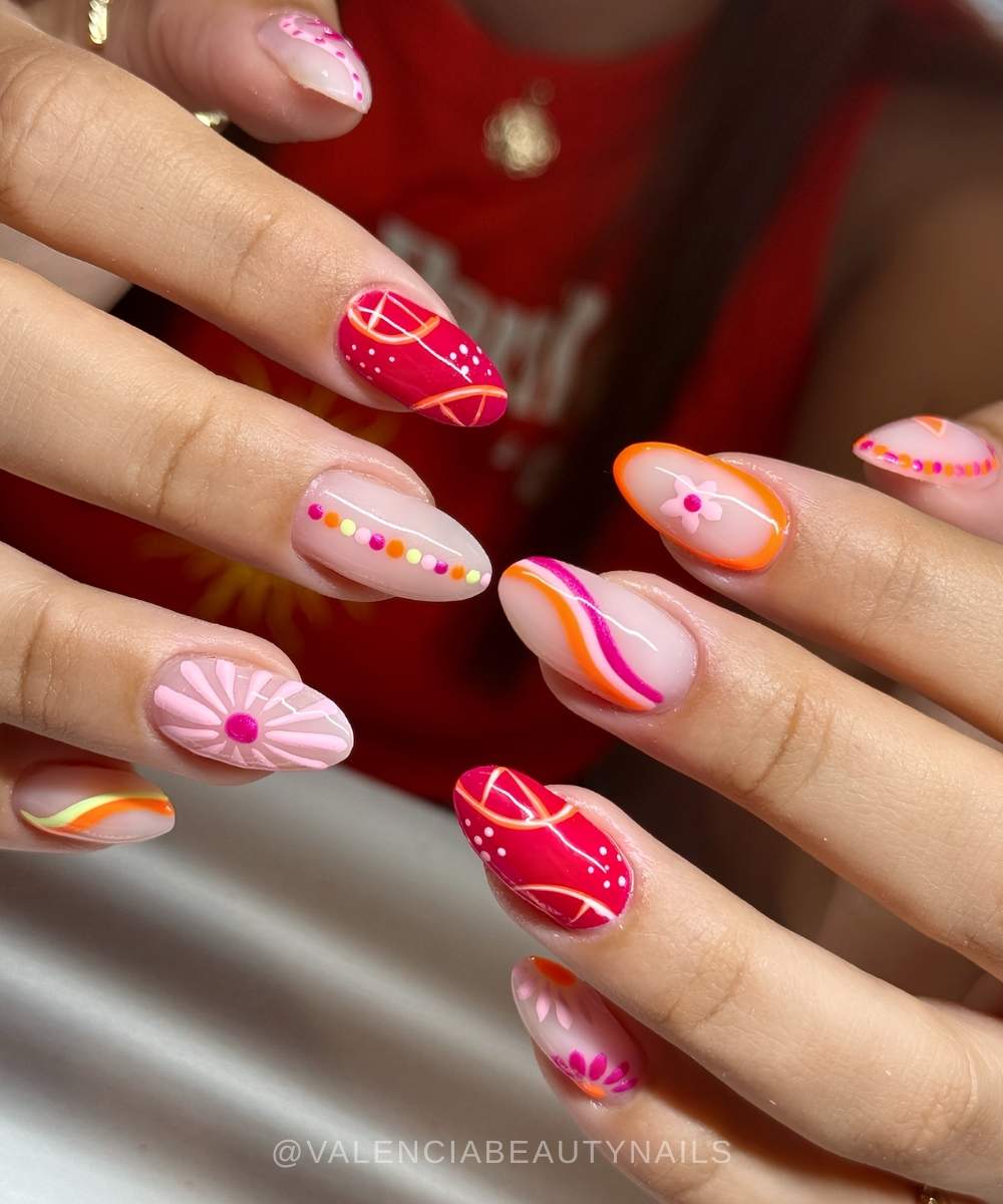 Pink and orange mismatched mani with citrus accents
