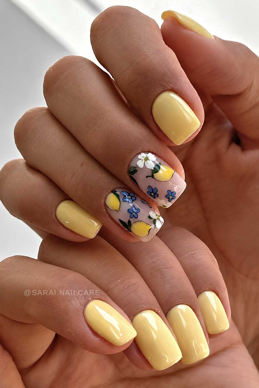 Short yellow nails with lemon and floral art