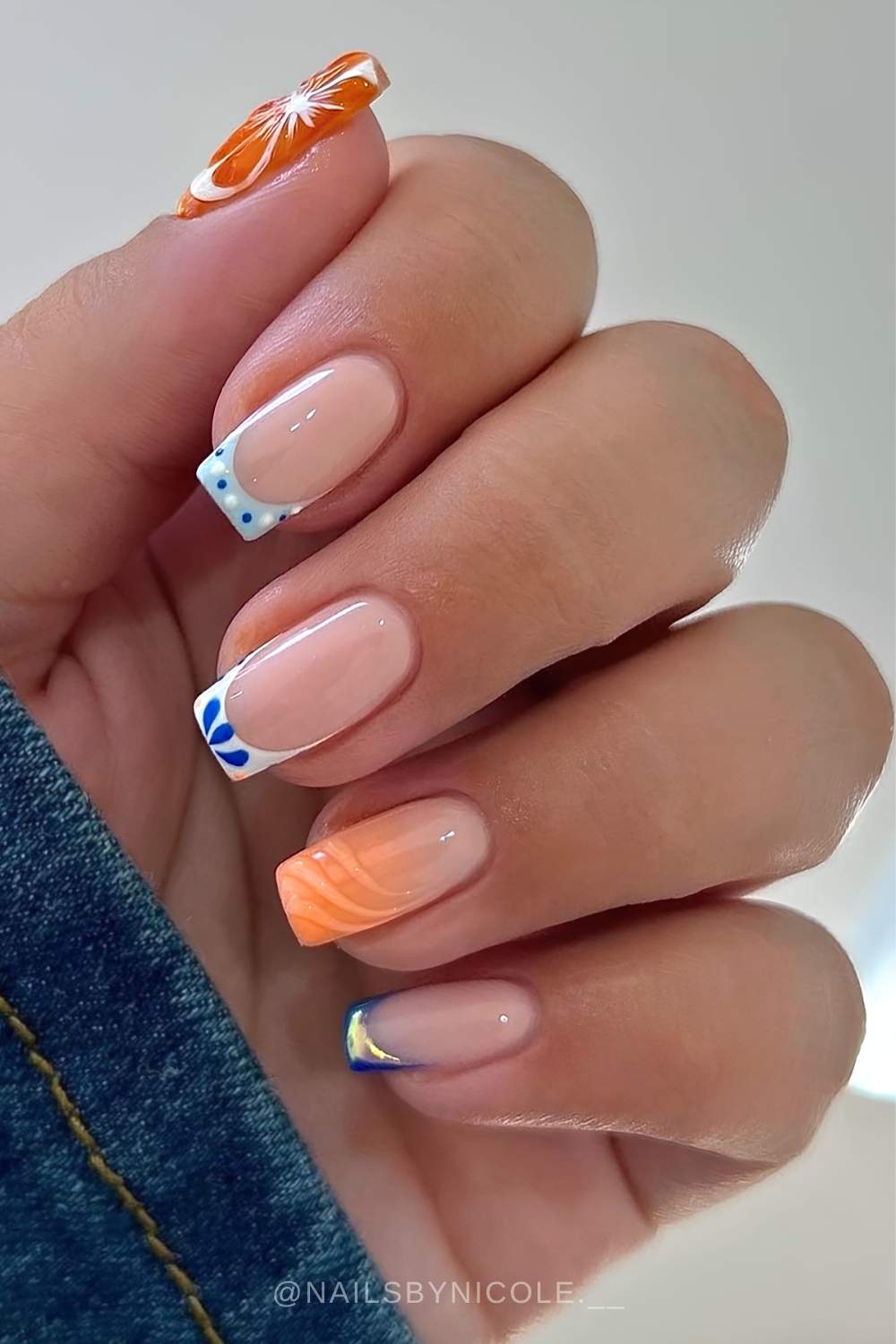 Square orange and blue nails with citrus and tile art