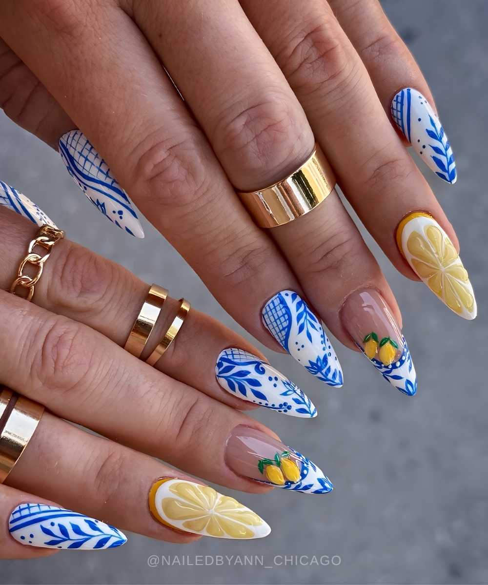 White and blue nails with tile style florals and lemon art