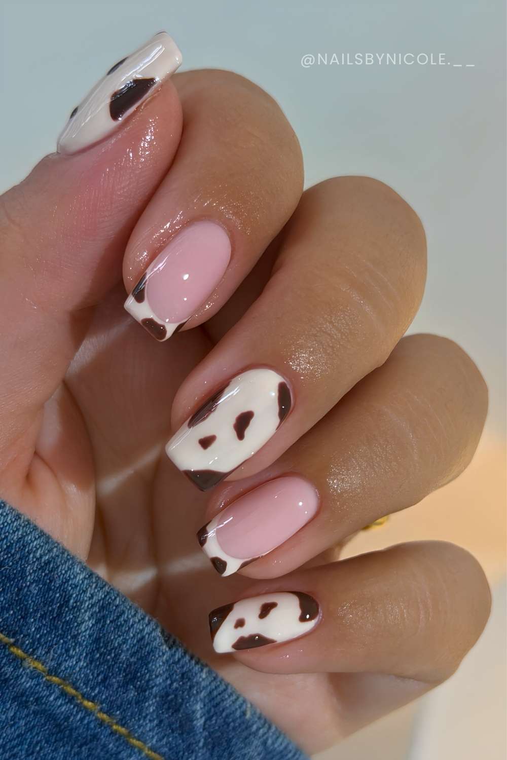 Beige and brown cow print nails