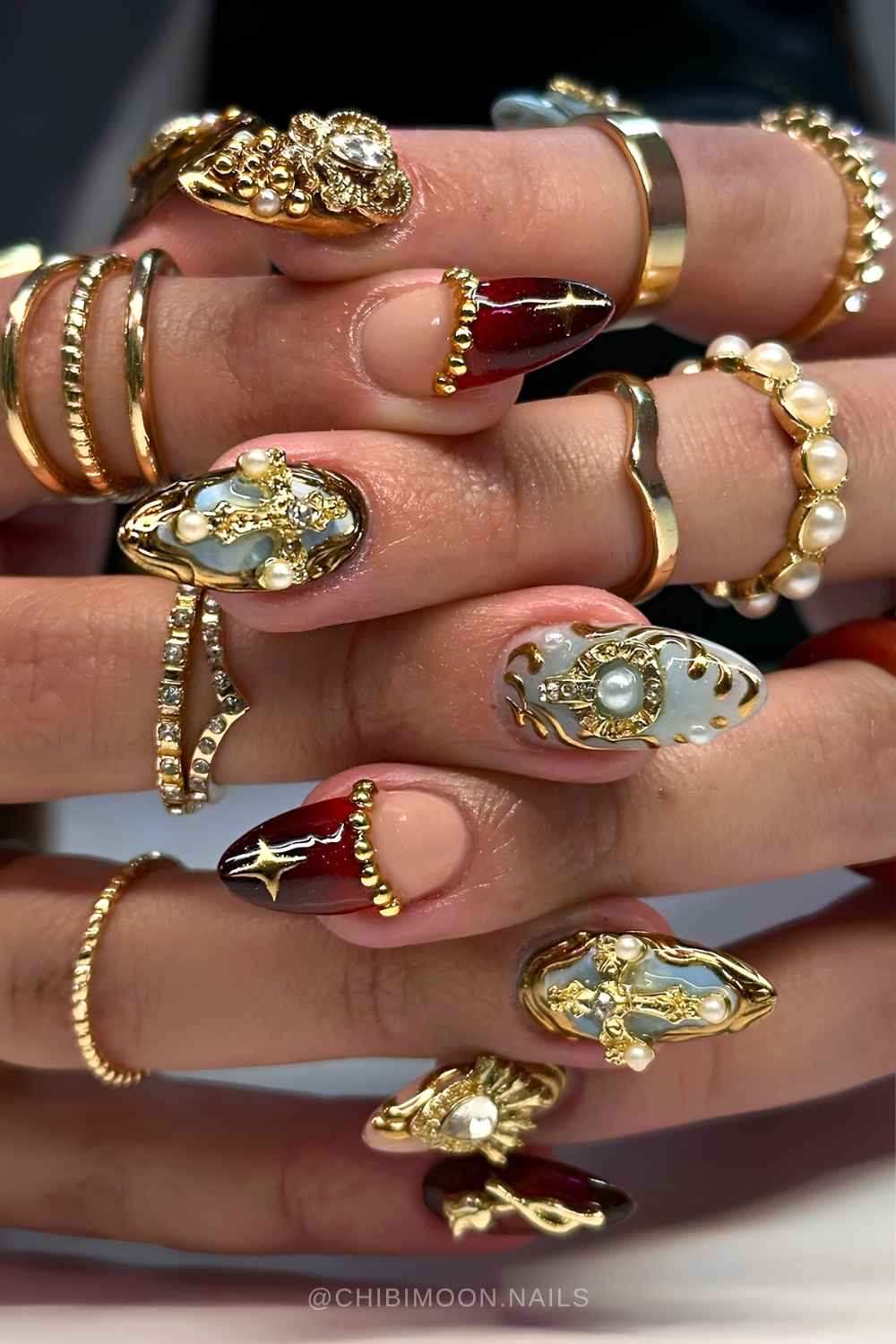 Blue and red mani with baroque jewelry art
