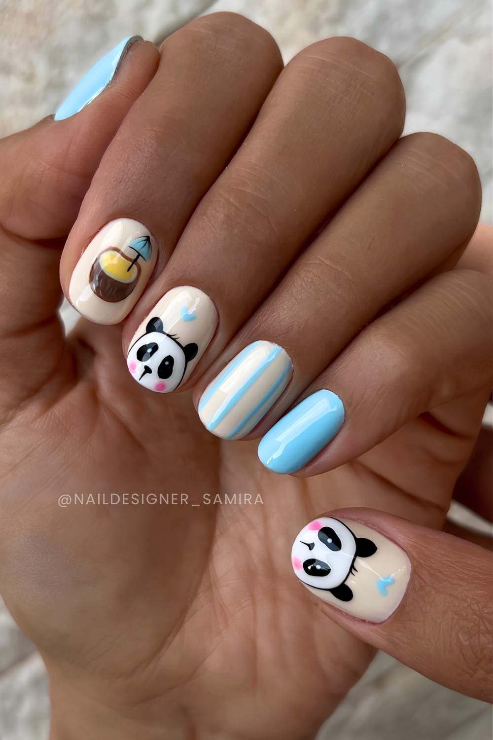 Blue and vanilla nails with cute panda art