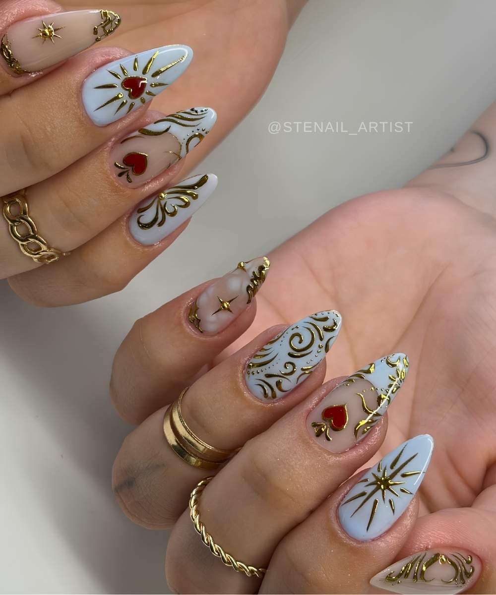 Blue nails with gold baroque swirls and sacred hearts