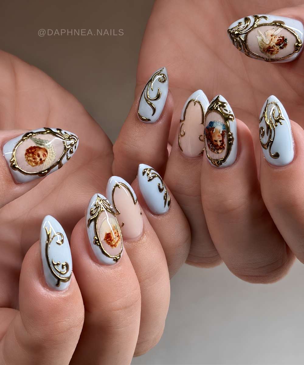 Blue nails with metallic baroque art