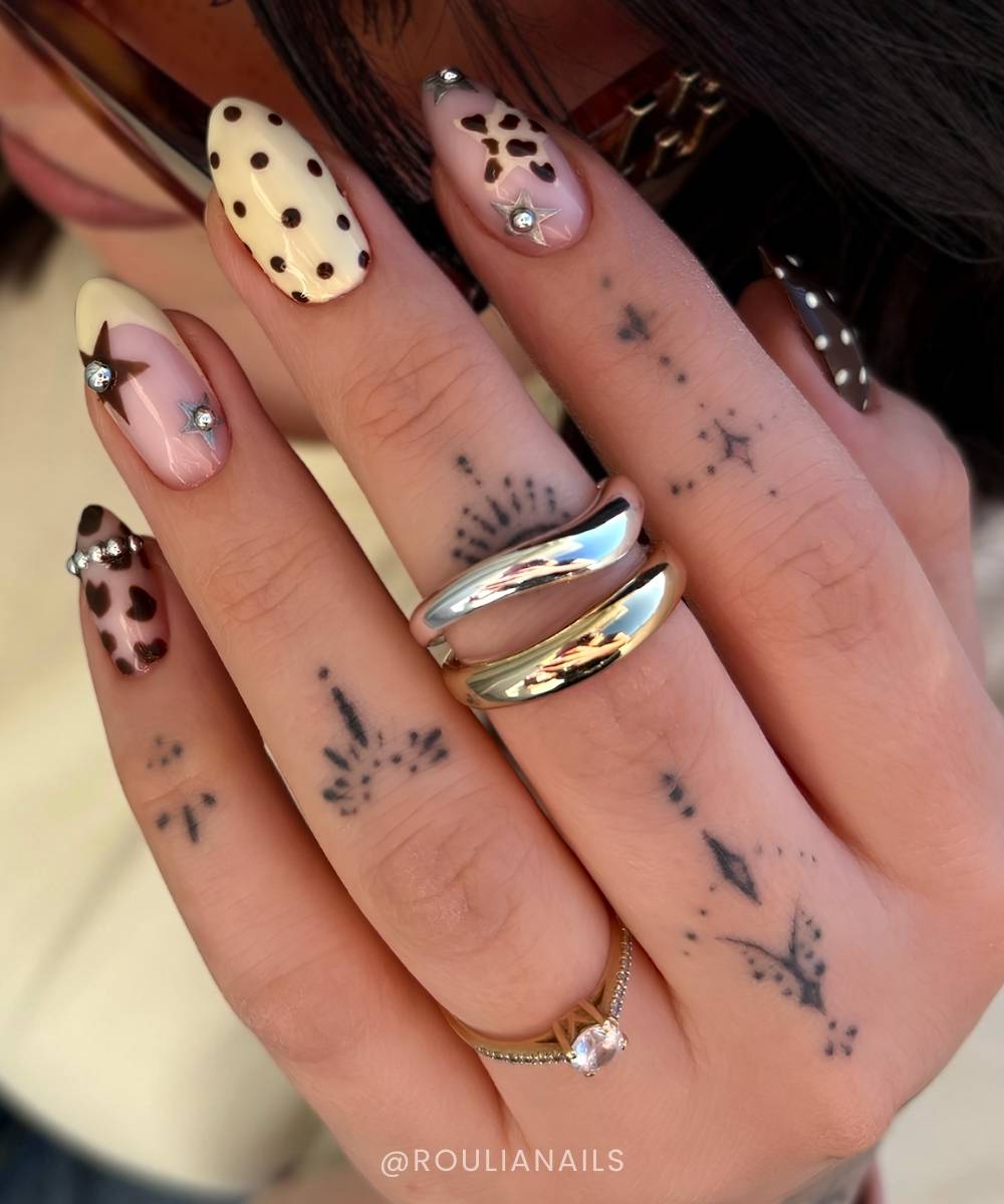 Brown and yellow nails with stars and cow print