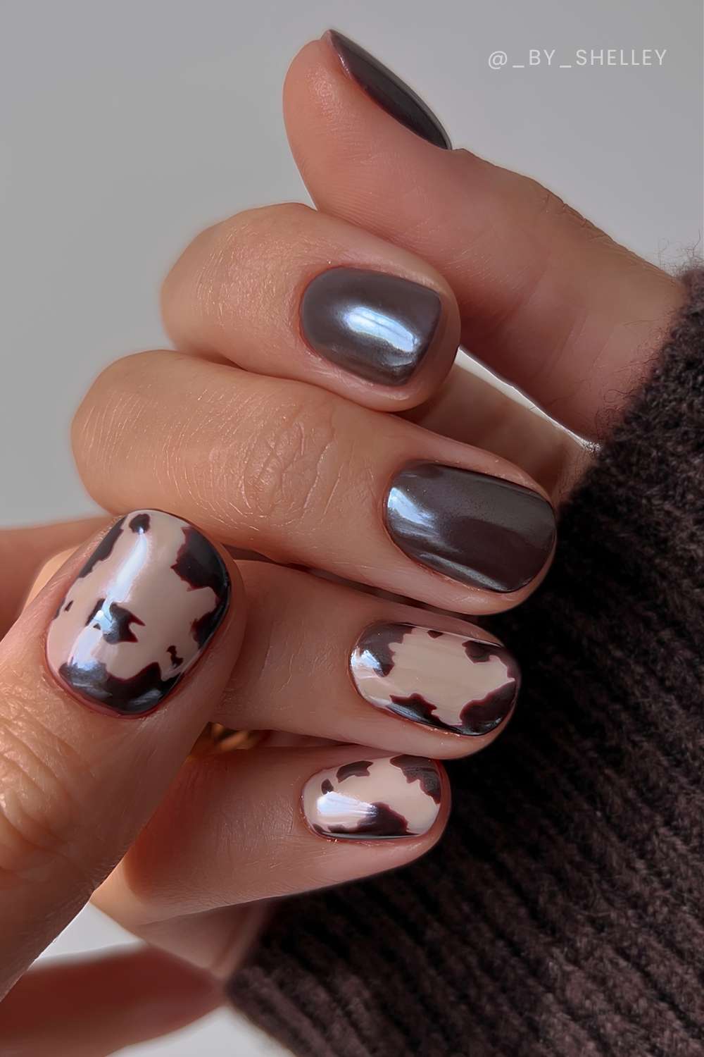 Brown chrome nails with cow print