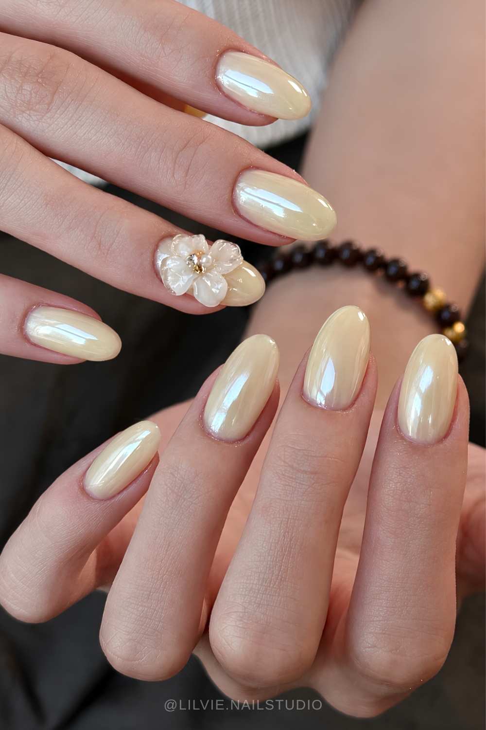 Butter yellow chrome nails with 3d flowers