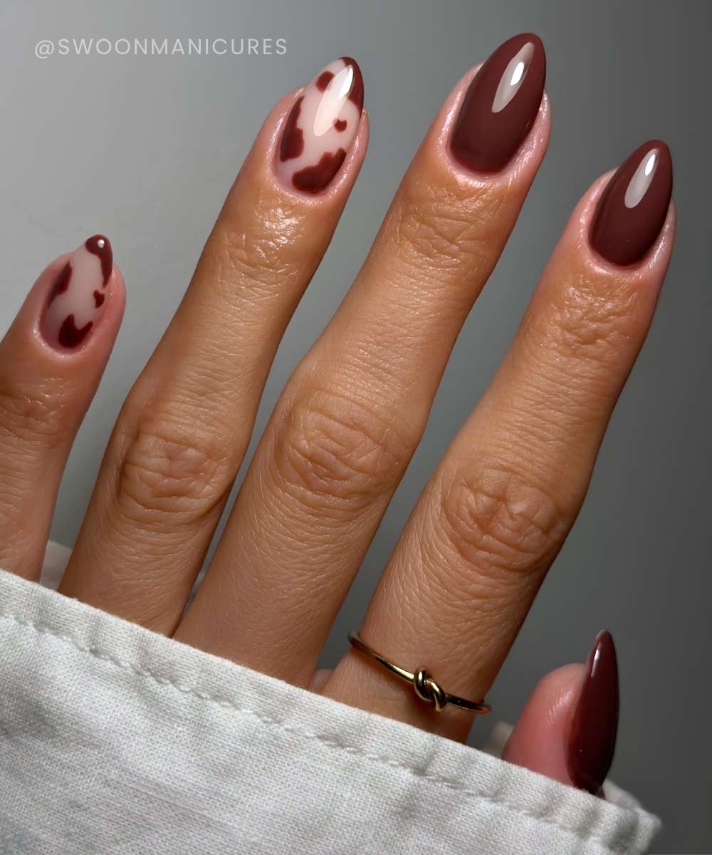 Chestnut brown nails with cow print