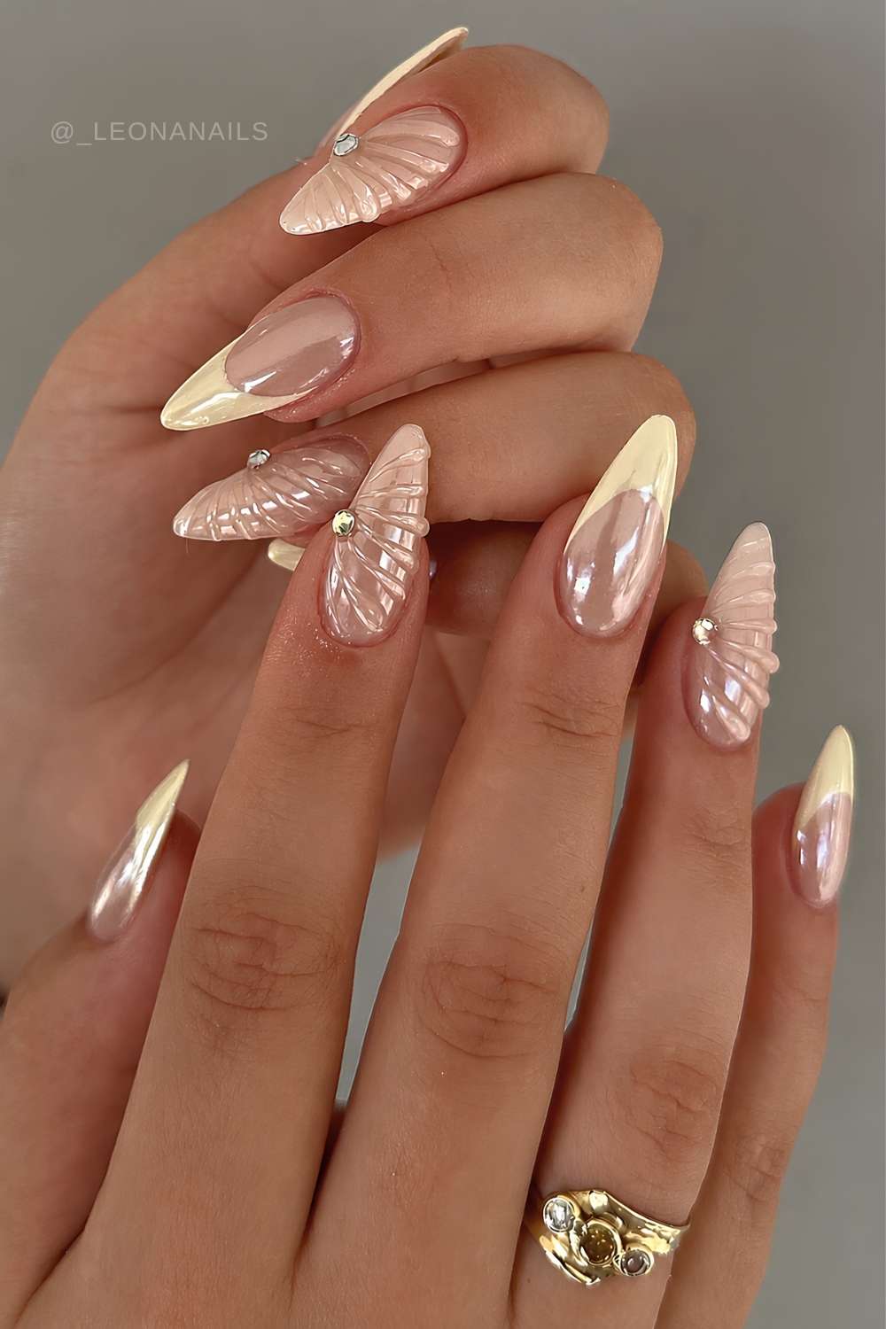 Chromed yellow French mani with textured shell accents