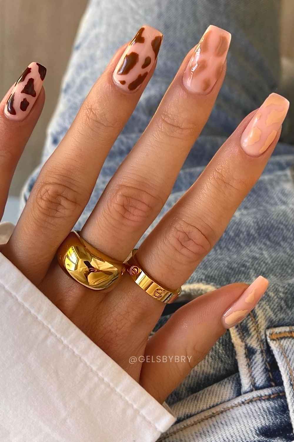 Cow print nails in different neutral shades