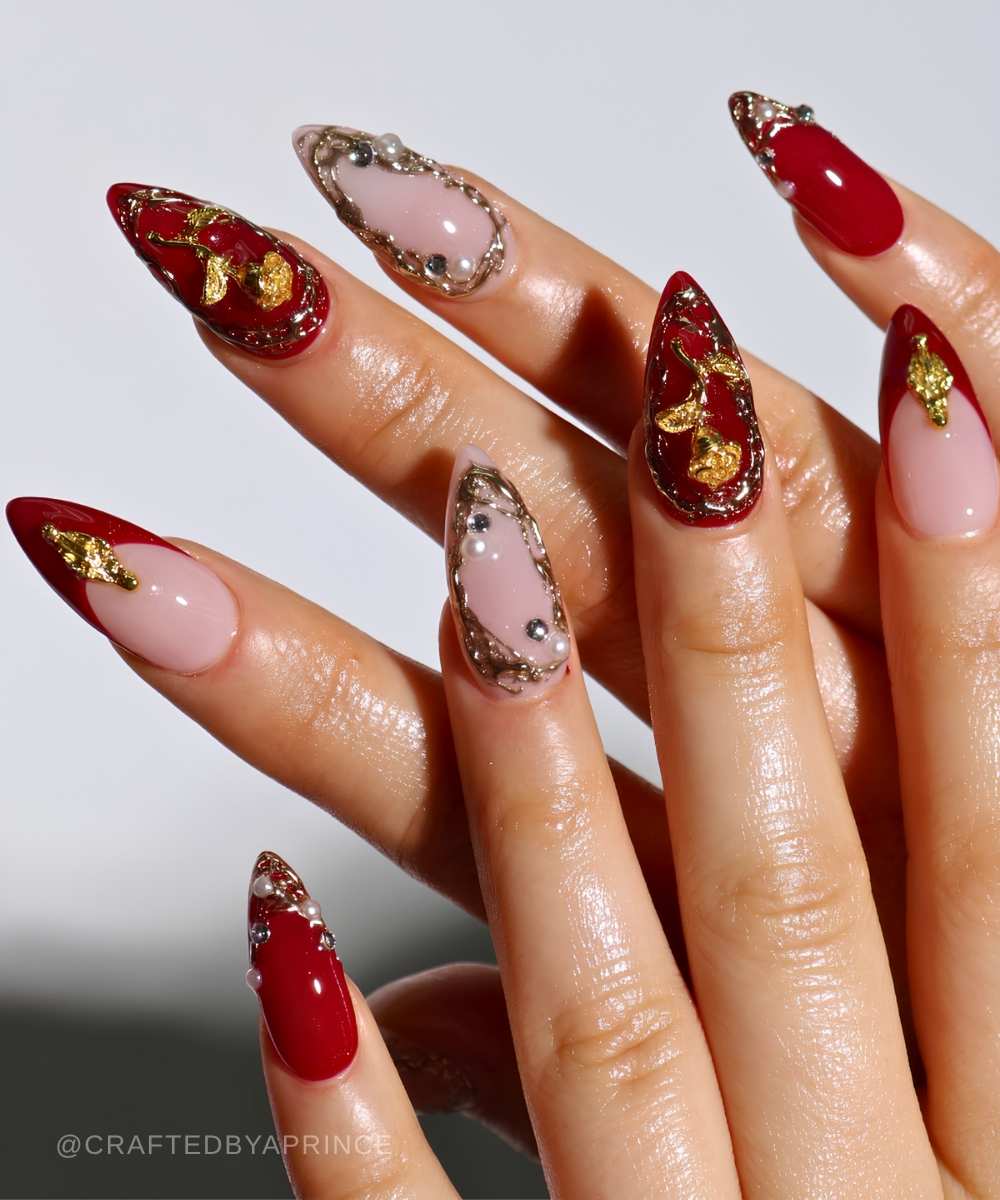 Deep red nails with gilded vintage flowers